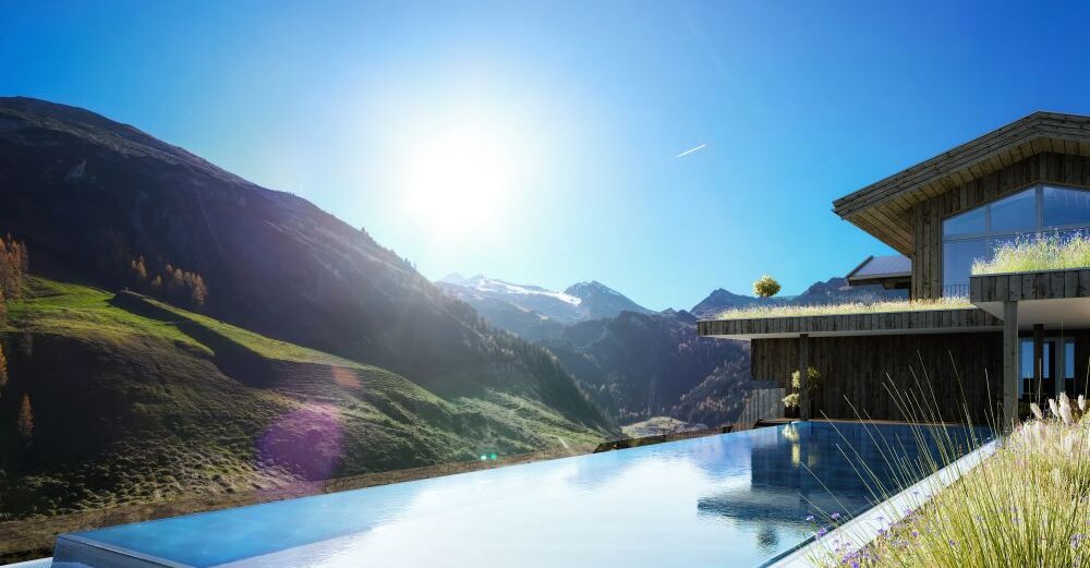 Ein moderner Pool mit Infinity-Design schimmert im Sonnenlicht, umgeben von majestätischen Alpenlandschaften.